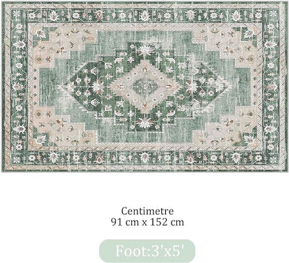 Close-up of the green boho rug's floral pattern and soft low-pile texture.