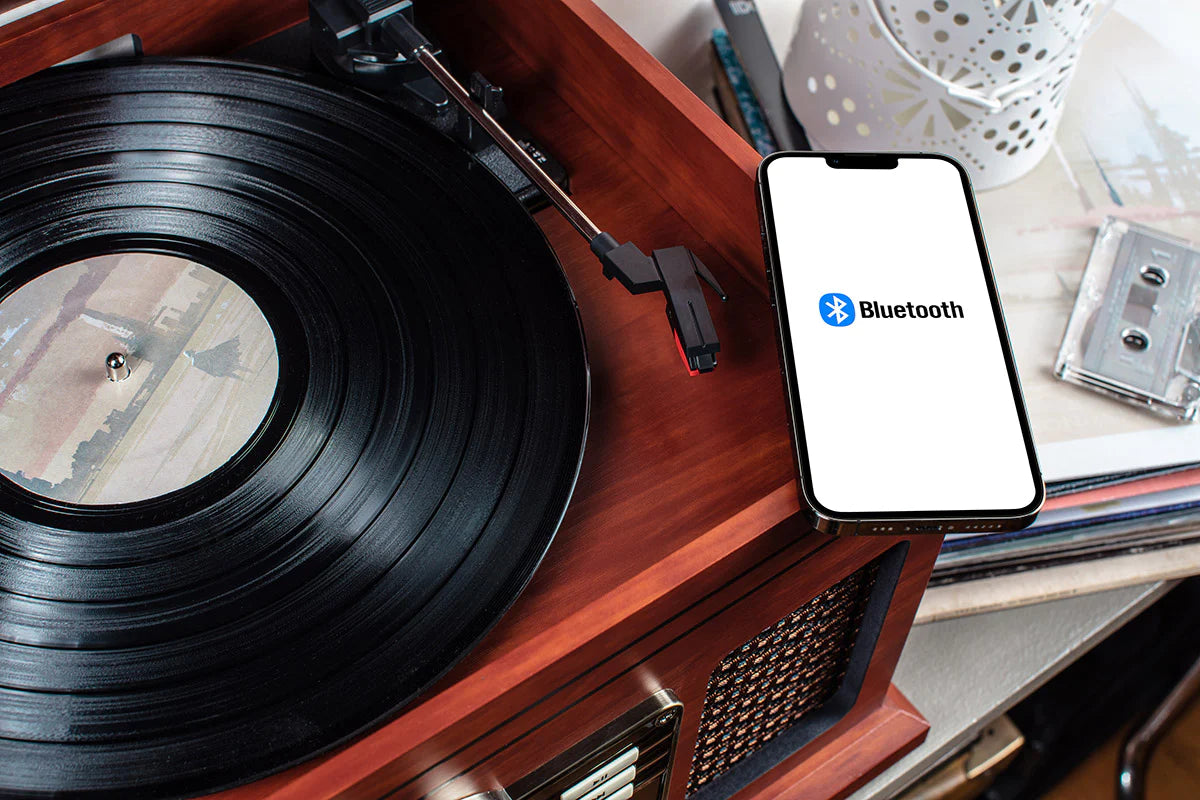 Victrola Nostalgic Record Player with smartphone connected via Bluetooth